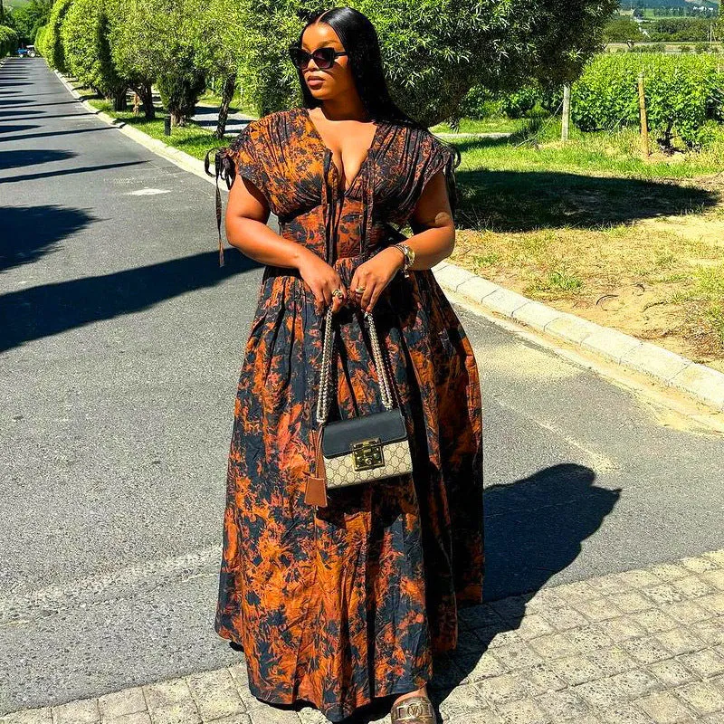 Elegant African-Inspired Print Flowing Maxi Dress with Lace-Up Detail
