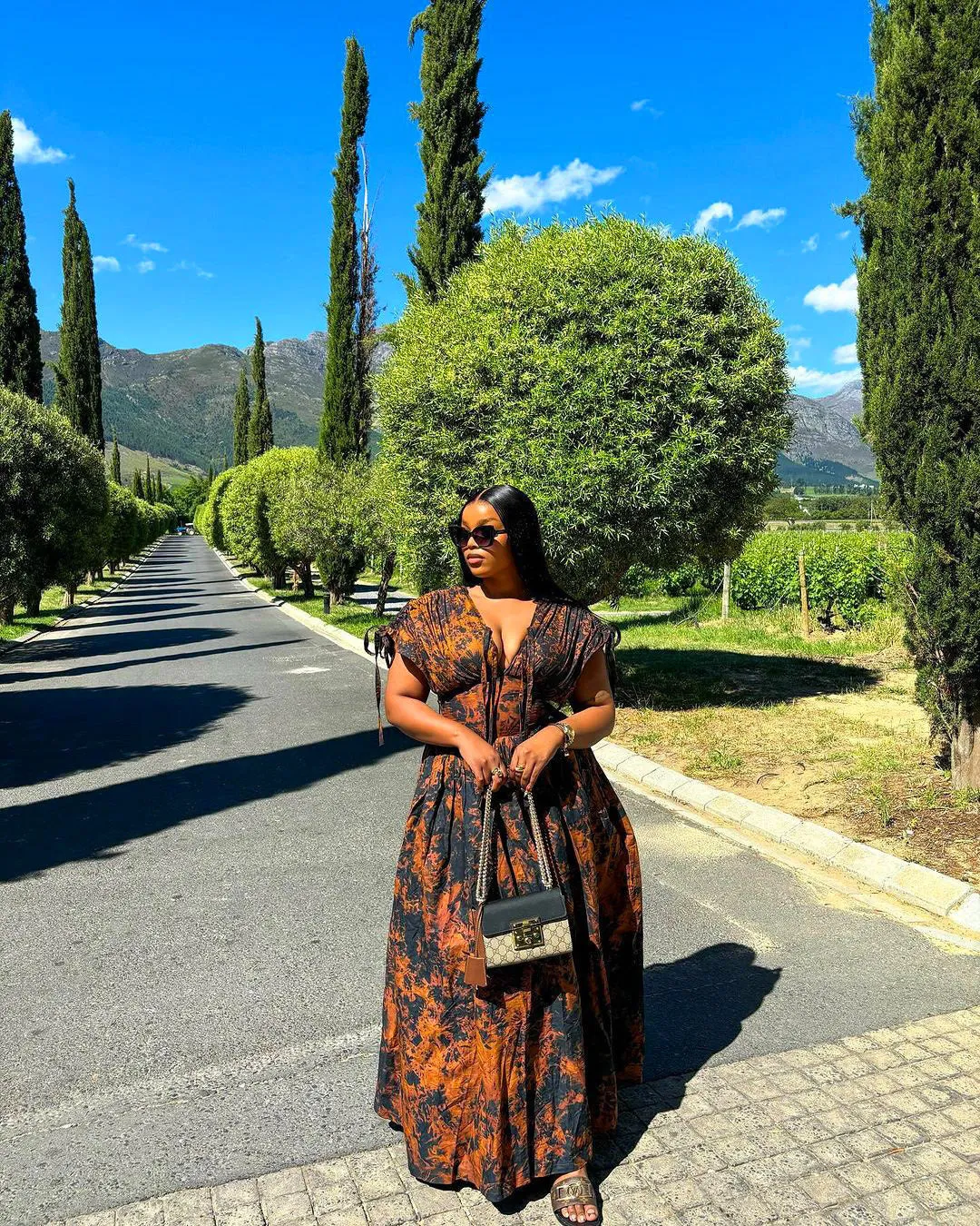 Elegant African-Inspired Print Flowing Maxi Dress with Lace-Up Detail