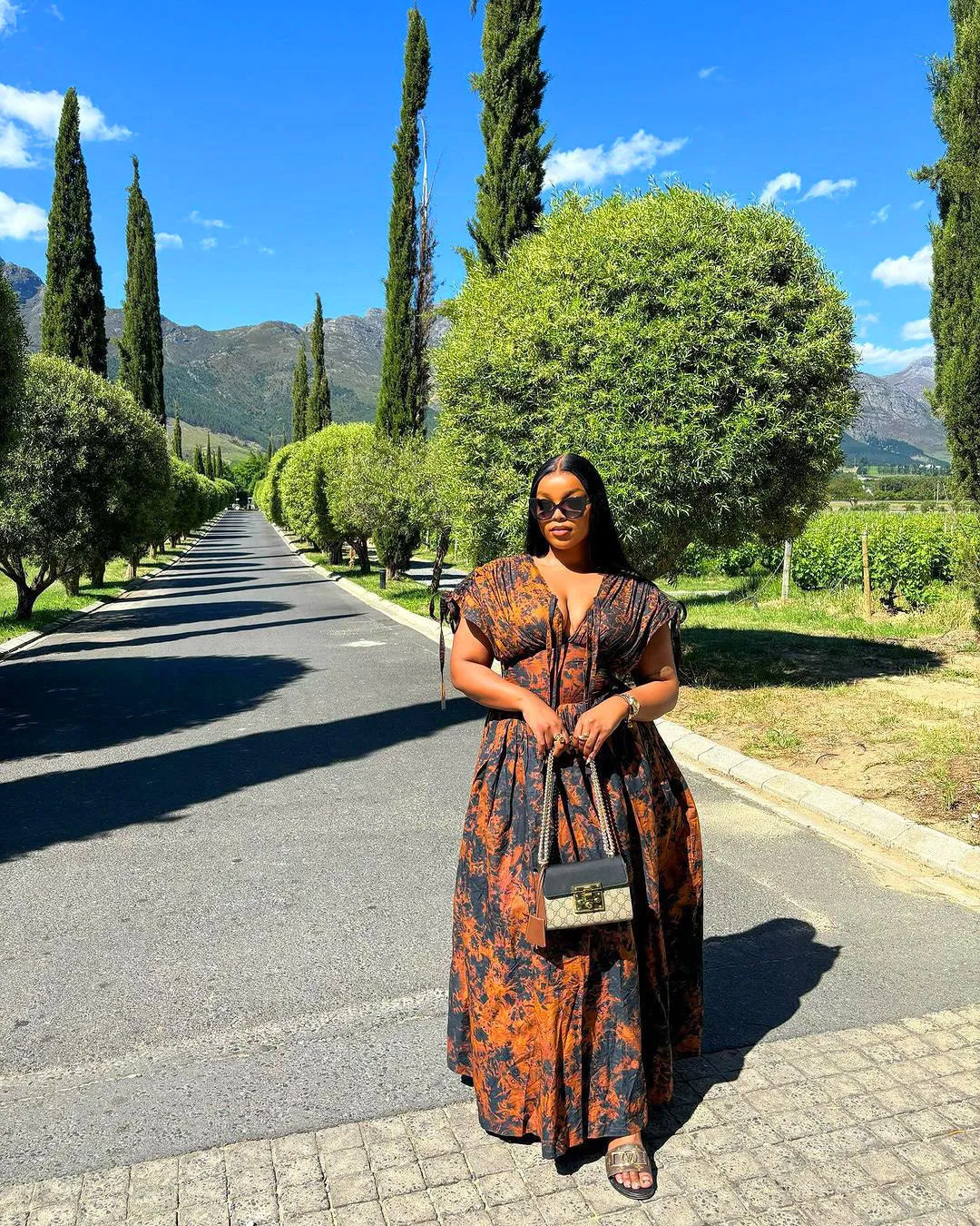 Elegant African-Inspired Print Flowing Maxi Dress with Lace-Up Detail
