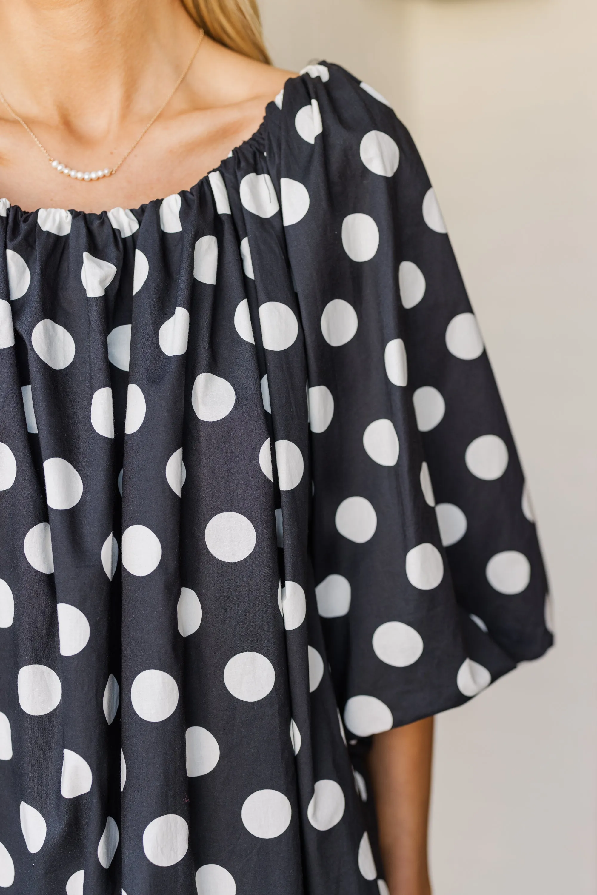 The Beyond Black Polka Dot Dress